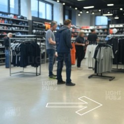 Projecteur flèche lumineuse au sol magasin de sport